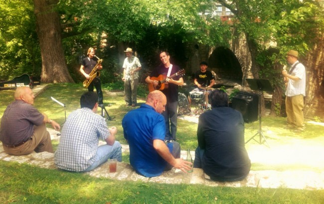 Jason Molin and band playing a concert at UT by Waller Creek